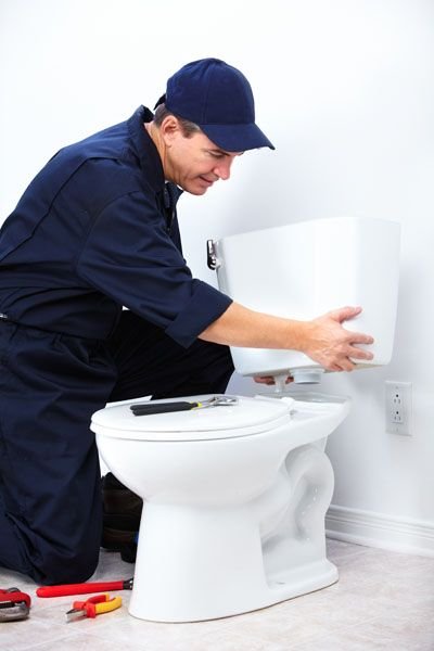 Plumber inspecting toilet El Paso TX
